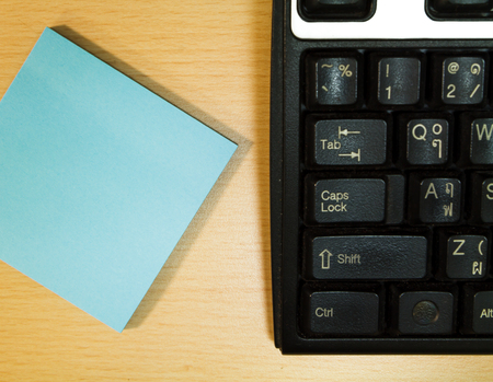 Keyboard and paper on the desk.の写真素材