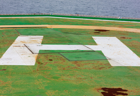 old helicopter landing area,sea,cloud sky background.の写真素材