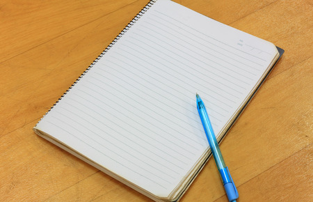 pen,notebook on wood background.の写真素材