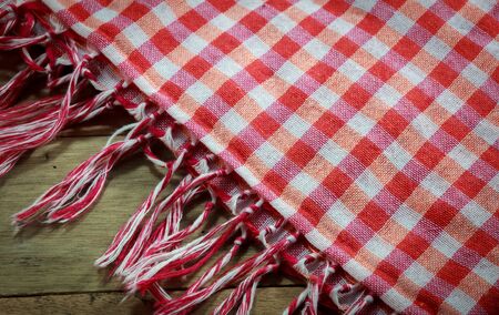 Old  beautiful red cloth on wodd background.の写真素材