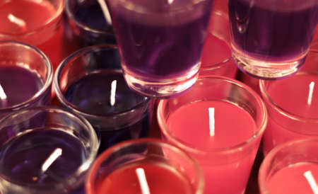 Blur background colorful candle in glass by vintage tone.の写真素材