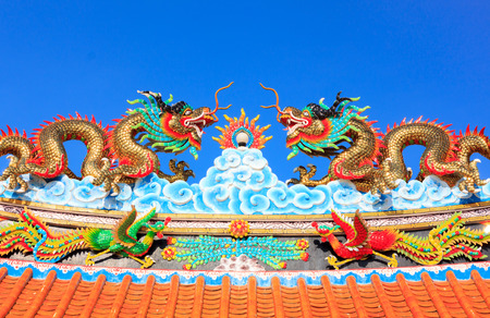 Dragon statue on roof ,sky.This object is public in temple Thailand .の写真素材