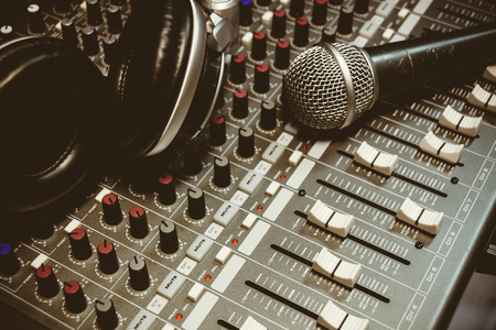 microphone ,headphone on sound mixer background.の写真素材
