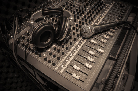 microphone ,headphone on sound mixer background.