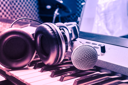 microphone,headphone on piano background.の写真素材
