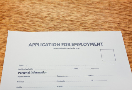 business document application form on wood background.の写真素材