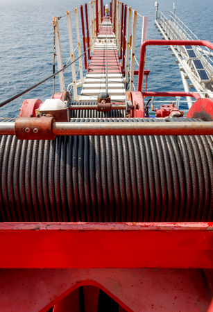 wire rope sling drum and boom crane offshore of offshore oil and gas field on remote wellhead...