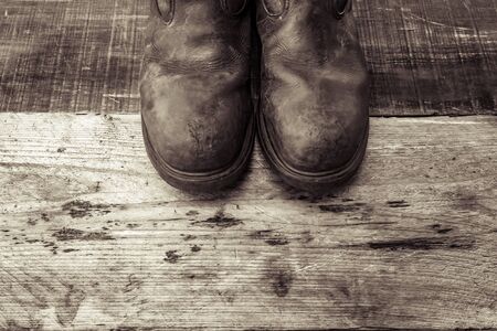 Safety boots on wood with copy space.の写真素材
