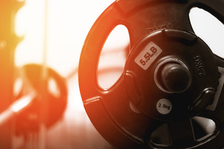 soft focus sport fitness equipment  the weight number of barbells  in gym.の写真素材