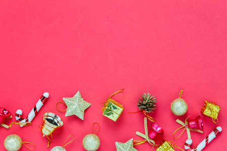 Top view Chrismas decoration and ornament on red background with copy space.の写真素材