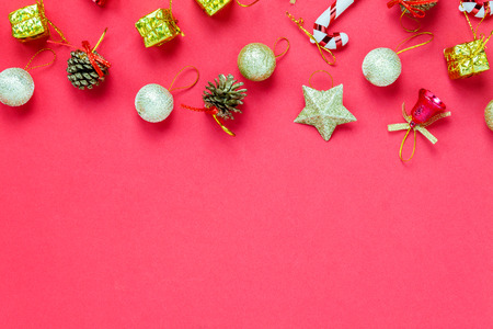 Top view Christmas decoration and Santa Claus doll on red background with copy space.の写真素材