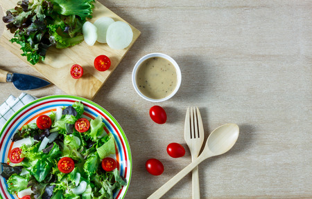 Top view cooking salad with sauce on wood table with copy space.の写真素材