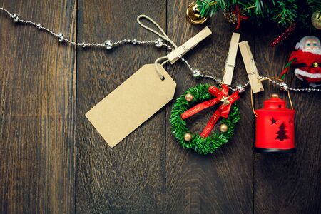 Top view Christmas   decoration,lamp,label and  jewelry clothesline on wooden table background with copy space.の写真素材