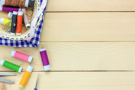 Top view tailor items on wooden background with copy space.の写真素材