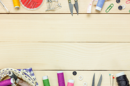Top view tailor items on wooden background with copy space.の写真素材
