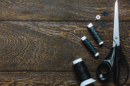 Top view tailor items on wooden background with copy space.の写真素材