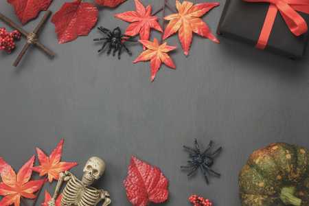 Top view / Flat lay Halloween 's pumpkin and accessories or items the leaf spider and gift / present on rustic wooden background.Idea for decoration / ornament to website banner  with copy space.の写真素材