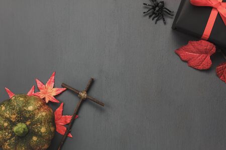 Top view / Flat lay Halloween 's pumpkin and accessories or items the leaf spider and gift / present on rustic wooden background.Idea for decoration / ornament to website banner  with copy space.の写真素材