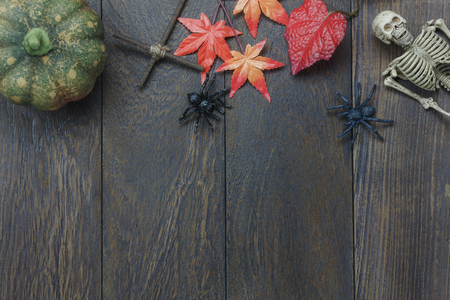 Table top of decoration sign Happy Halloween festival background. with beautiful orange tulip and maple leaf.Object on rustic wooden.Copy space for text information.Dark tone design.の写真素材