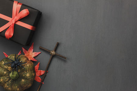 Table top of decoration sign Happy Halloween festival background. with beautiful orange tulip and maple leaf.Object on rustic wooden.Copy space for text information.Dark tone design.の写真素材