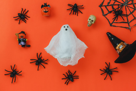 Flat lay of accessory decoration Happy Halloween festival background concept.Mix variety object on the modern rustic orange wooden at home office desk.Necessary items for ornament the season.の写真素材