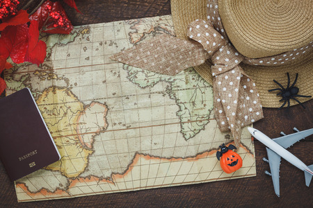 Top view of accessory Happy Halloween with items to travel background concept.Mix several object on the modern rustic brown wooden at home office desk.Equipment for traveler or teenage and adult.の写真素材