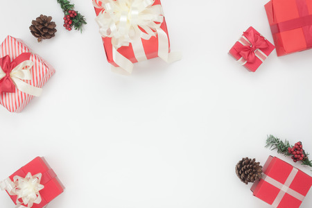 Overhead shot for decoration & ornament Merry Christmas & Happy new year concept.Difference size red gift box on modern rustic white background at home office studio.Copy space for creative text.の写真素材