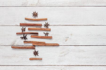 Top view aerial image of ornaments & decorations Merry Christmas and Happy new year concept.Fir tree handmade of creative design by cinnamon.Object on modern rustic white background.Copy space design.の写真素材