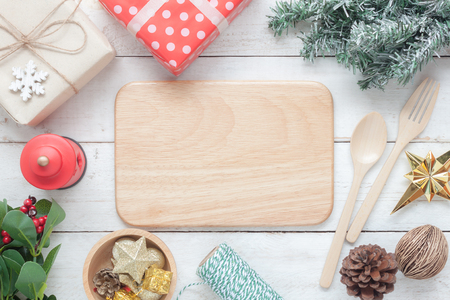 Table top view aerial image of items Happy new year & Merry Christmas background concept.Beautiful essential decorations & ornaments for decor for winter season at home.All object on white wooden deskの写真素材