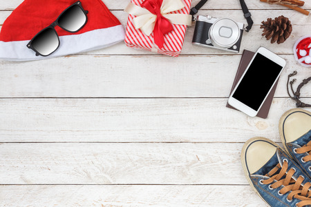 Top view aerial image of decorations & ornaments Merry Christmas & Happy New Year background concept.several accessories on modern rustic white wooden at office desk.Item for traveler to travel trip.の写真素材