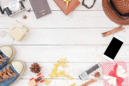Flat lay aerial image shot of decorations and ornaments Merry Christmas & Happy New Year background concept.Objects on modern rustic white wooden at table studio.Items for traveler to travel trip.の写真素材