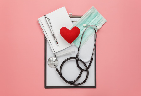 Table top view aerial image of accessories healthcare & medical background concept.several equipment on modern rustic pink paper at table studio.Item for doctor using care patient in hospital.の写真素材