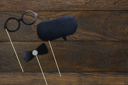 Table top view aerial image Happy Fathers day holiday background concept.Flat lay photo booth prob sign of season on modern rustic brown wooden at home office desk.Copy space for creative design text.の写真素材