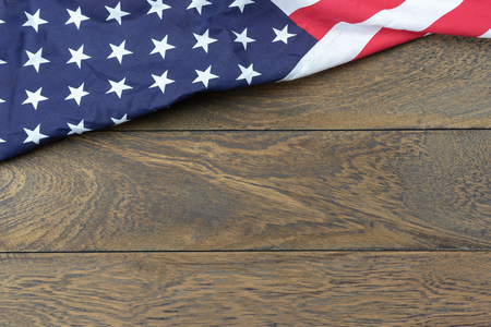 Table top view 4 th July independence day holiday background concept.Flat lay USA flag for sign of season on modern rustic brown wooden at office desk.Free space for creative design text & content.の写真素材