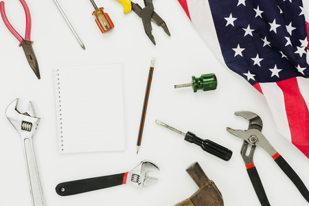 Table top view aerial image of decoration the sign of USA labor day on Sep 3,2018 background concept. Flat lay accessories US flag and date & space note book on modern rustic white wooden & copy spaceの写真素材
