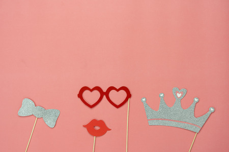 Table top view aerial image of sign anniversary day background concept.Photo booth props on modern grunge pink wallpaper at home office desk studio.Space for creative design mock up & templates.の写真素材