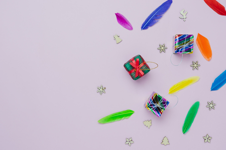Table top view of Merry Christmas decorations & Happy new year ornaments concept.Flat lay essential objects the colorful decor snow & gift box on modern pink paper background at home office desk.の写真素材
