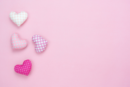 Table top view aerial image of decoration valentine's day background concept.Flat lay essential items colorful pastel love shape on modern rustic pink paper.blank space for mock up creative design.の写真素材