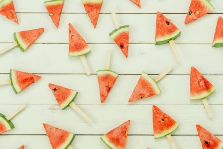 Table top view fruit tropical with drink with spring summer holiday & vacation background concept.Arrangement slices watermelon ice cream  pattern on modern white wooden.Copy space for design text.の写真素材