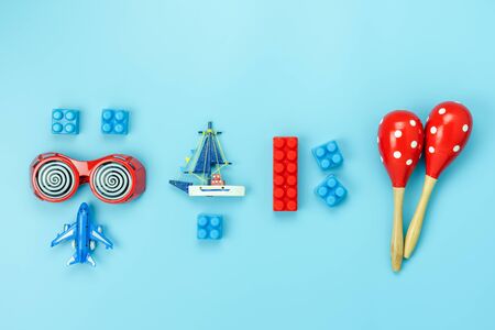 Table top view decoration kid toys for develop background concept.Flat lay accessories baby to play with items child on modern pink paper at office desk.Copy space for add text.pastel tone wallpaper.の写真素材