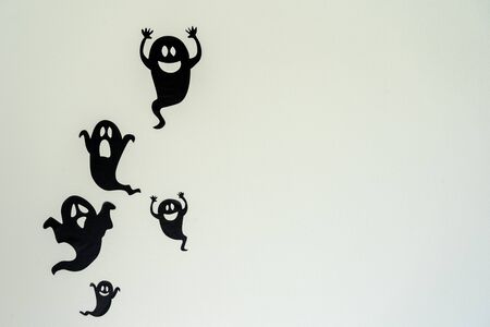 Table top view aerial image of decoration Happy Halloween day background concept.Flat lay accessories essential object to party the black ghost on rustic white stone.Space for creative design text.の写真素材