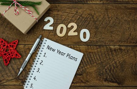 Table top view aerial image of 2020 new year business  goals & plans concept.Flat lay of essential...