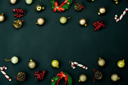 Table top view of Merry Christmas decorations & Happy new year ornaments concept.Flat lay essential difference objects gift box & fir tree on modern black paper background at home studio office desk.の写真素材