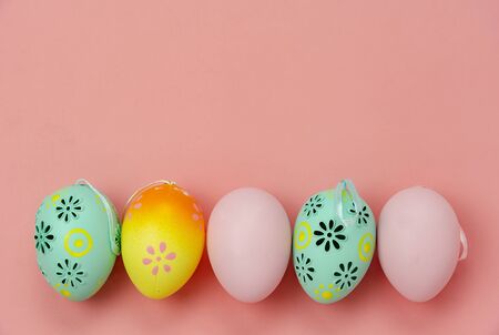 Top view shot of arrangement decoration Happy Easter holiday background concept.Flat lay colorful Easter egg with flower and rabbit doll on modern rustic white wooden at office desk.space for mock upの写真素材