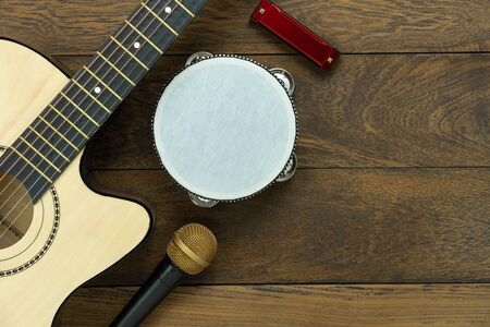 Table top view of music instrument tools concept background.Flat lay of sign to sing for musician or...