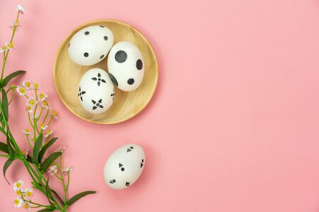 Top view aerial image of decoration & symbol Happy Easter holiday background concept.Flat lay accessory bunny eggs & floral on modern beautiful pink paper at home office desk.Free space for design.の写真素材