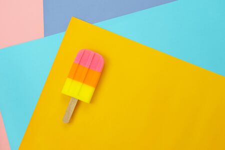 Table top view aerial image of sign or food of summer season holiday background concept.Flat lay of pastel ice cream on modern rustic mix paper backdrop.Minimalism creative design. copy space.の写真素材