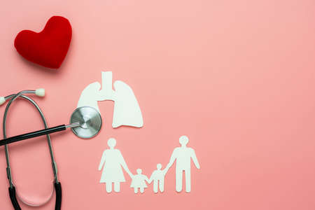 Table top view aerial image of accessories healthcare & medical of National Organ Donor Day with Valentines day background concept.Stethoscope red heart family with lung on pink paper.copy spaceの写真素材