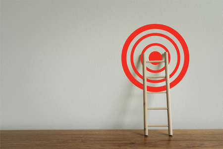 Wooden ladder with red target achievement, Business growth up and successful concept. Goal success...