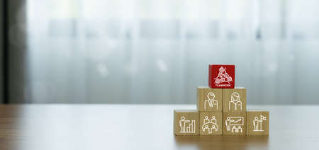 Unity and teamwork icon concept on wood box .cooperation success business.Hand united together. Mission, Trust, support, Cooperation, Brainstorming, Planning, Discussion, collaboration, communication,の写真素材